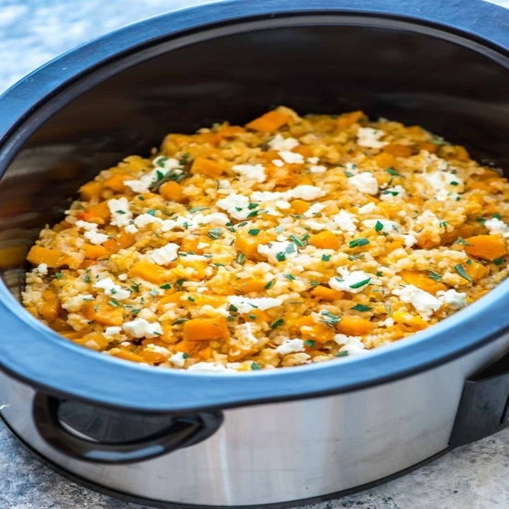 A slow cooker filled with butternut squash risotto.