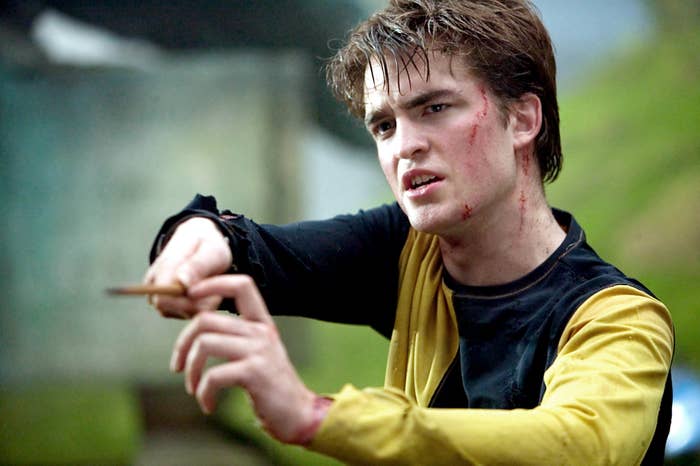 Cedric Diggory holding his wand