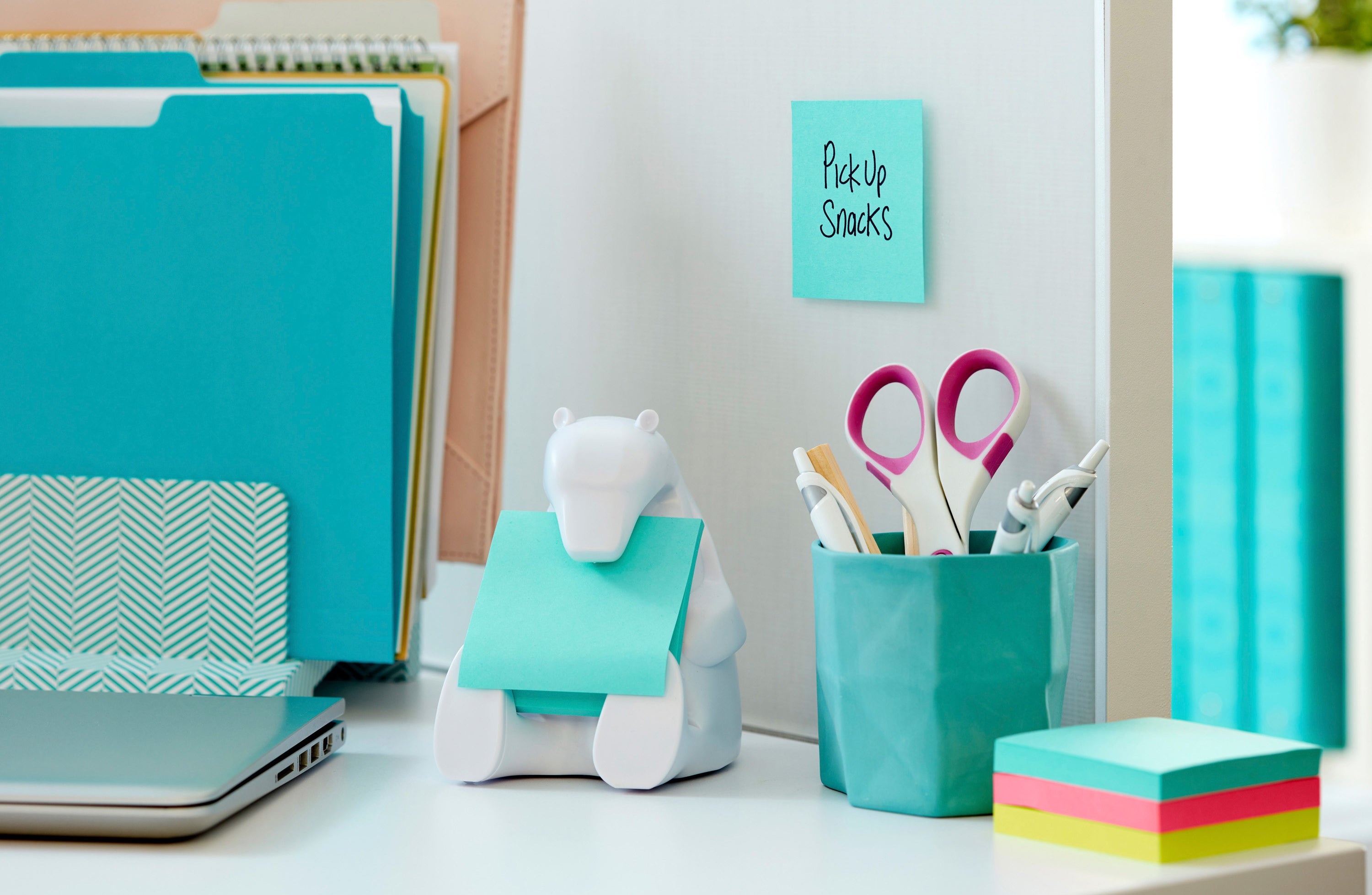 A white bear Post-It dispenser holding Post-It notes