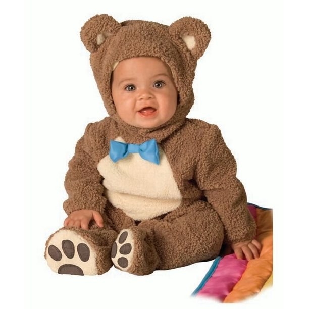 Child in the teddy bear costume with rainbow tail