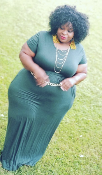 Reviewer in emerald green maxi dress