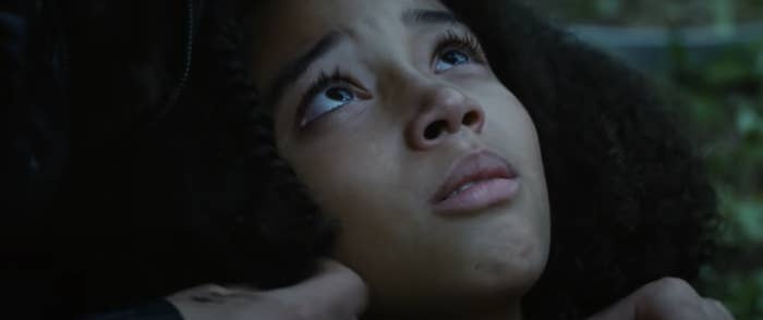 Rue looking up at Katniss as she dies