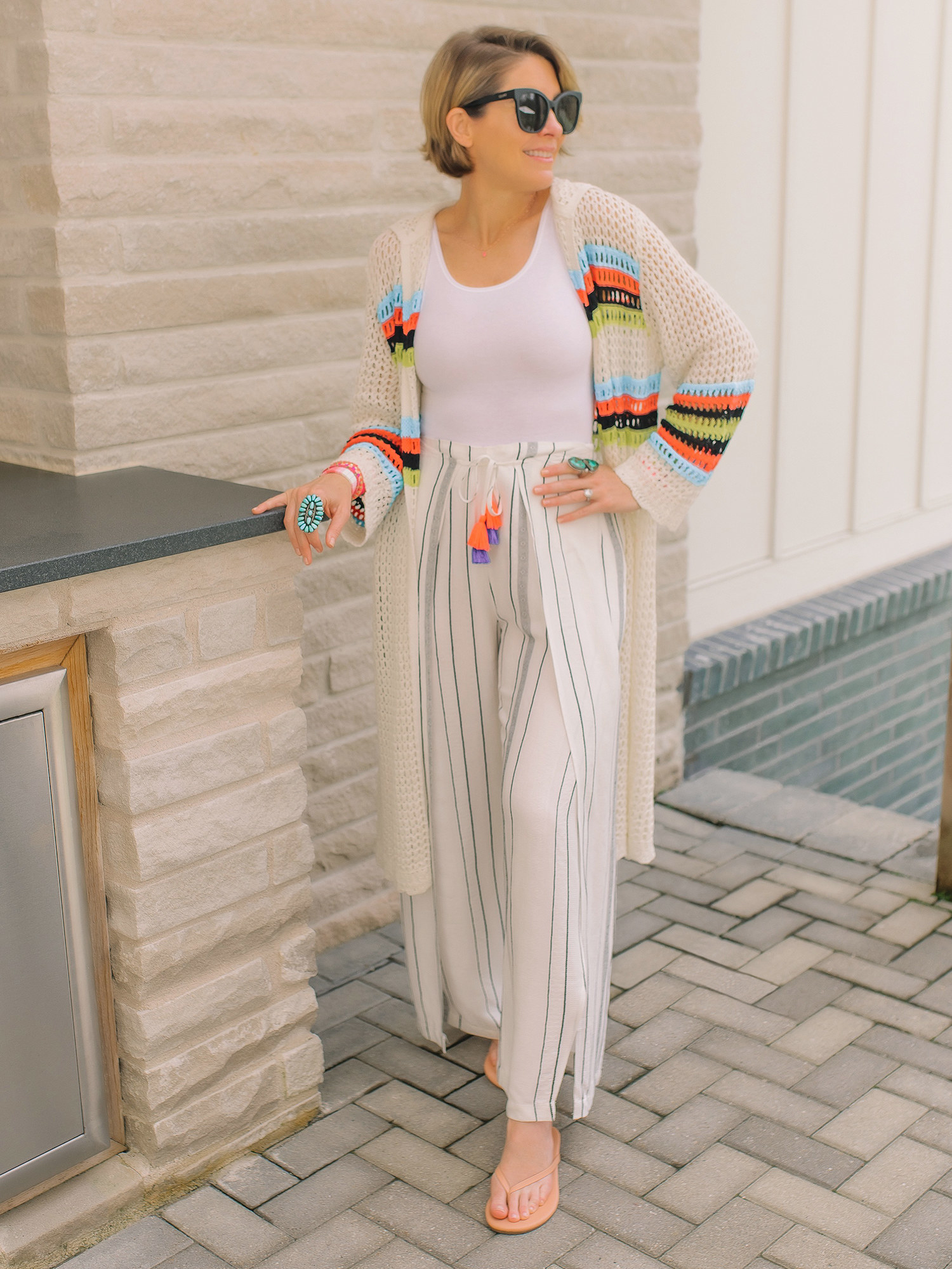 Model wears the white cardigan