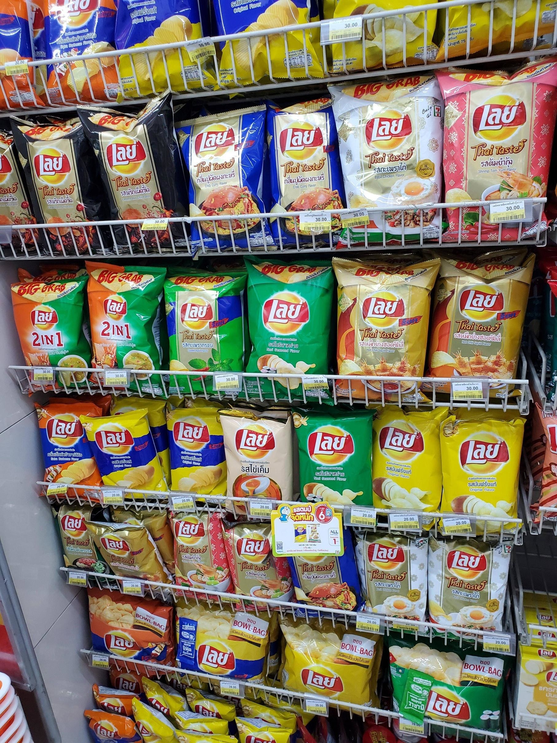 A whole wall of different flavored Lays chips