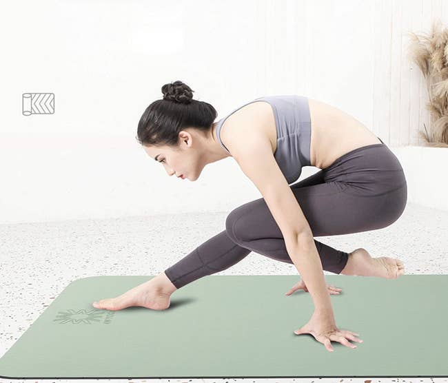 Model on a green yoga mat 