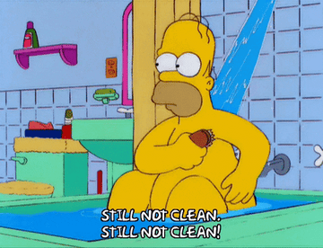 GIF of Homer Simpson in tub scrubbing himself and repeating &quot;still not clean&quot; 