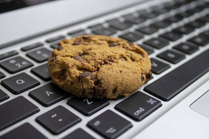 Chocolate chip cookie on a laptop keyboard