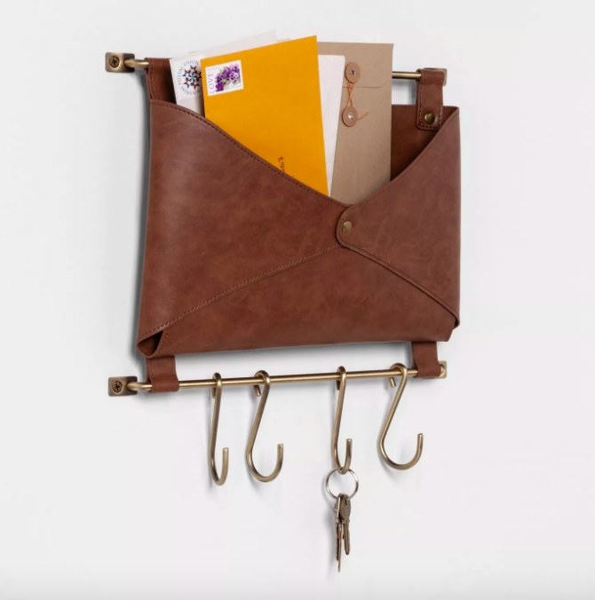 The brown leather wall-mounted folio envelope