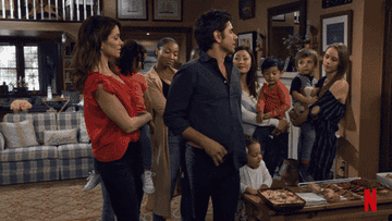 GIF from Fuller House of Uncle Jessie spinning and showing off a pair of yoga pants 