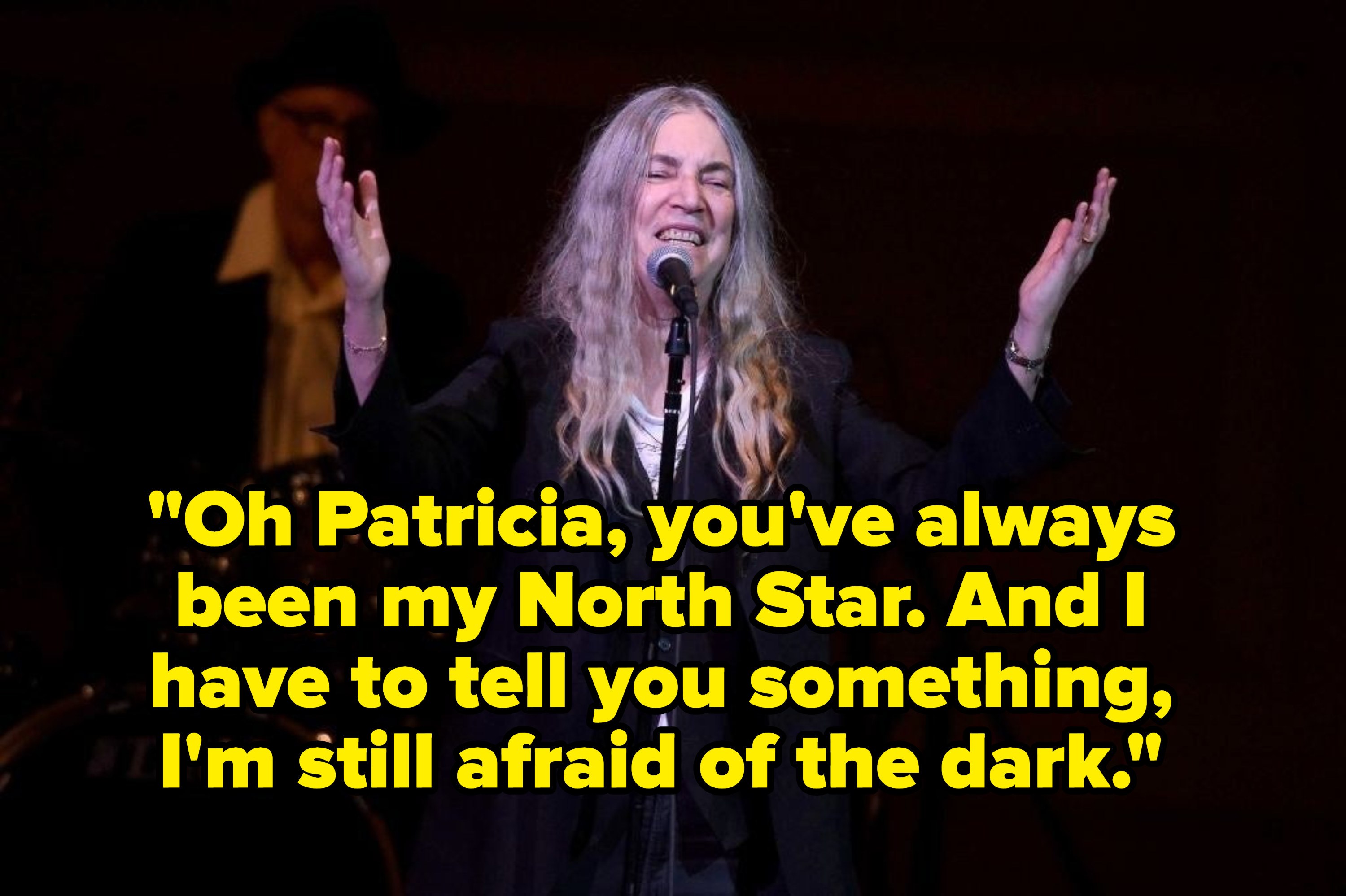 Patti Smith singing on stage, captioned with the lyric &quot;Oh Patricia, you&#x27;ve always been my North Star. And I have to tell you something I&#x27;m still afraid of the dark.&quot;