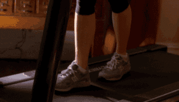 Liz Lemon from &quot;30 Rock&quot; walking on a treadmill, eating pudding, and saying &quot;wooo.&quot;