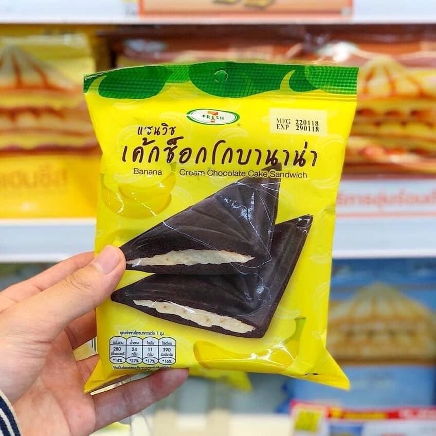 A packet containing a banana cream chocolate cake flavored sandwich.