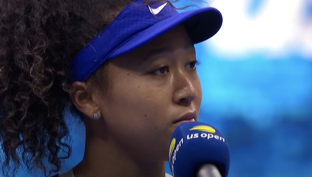 Naomi speaks into a microphone at the US Open
