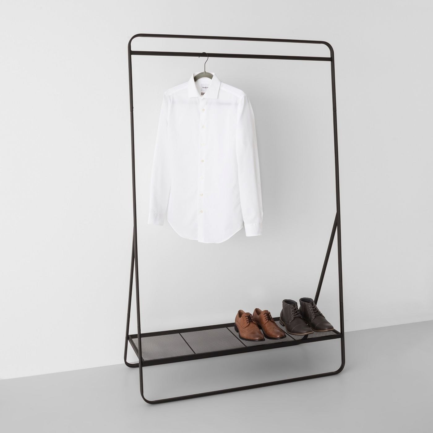 Metal garment rack with clothes on it