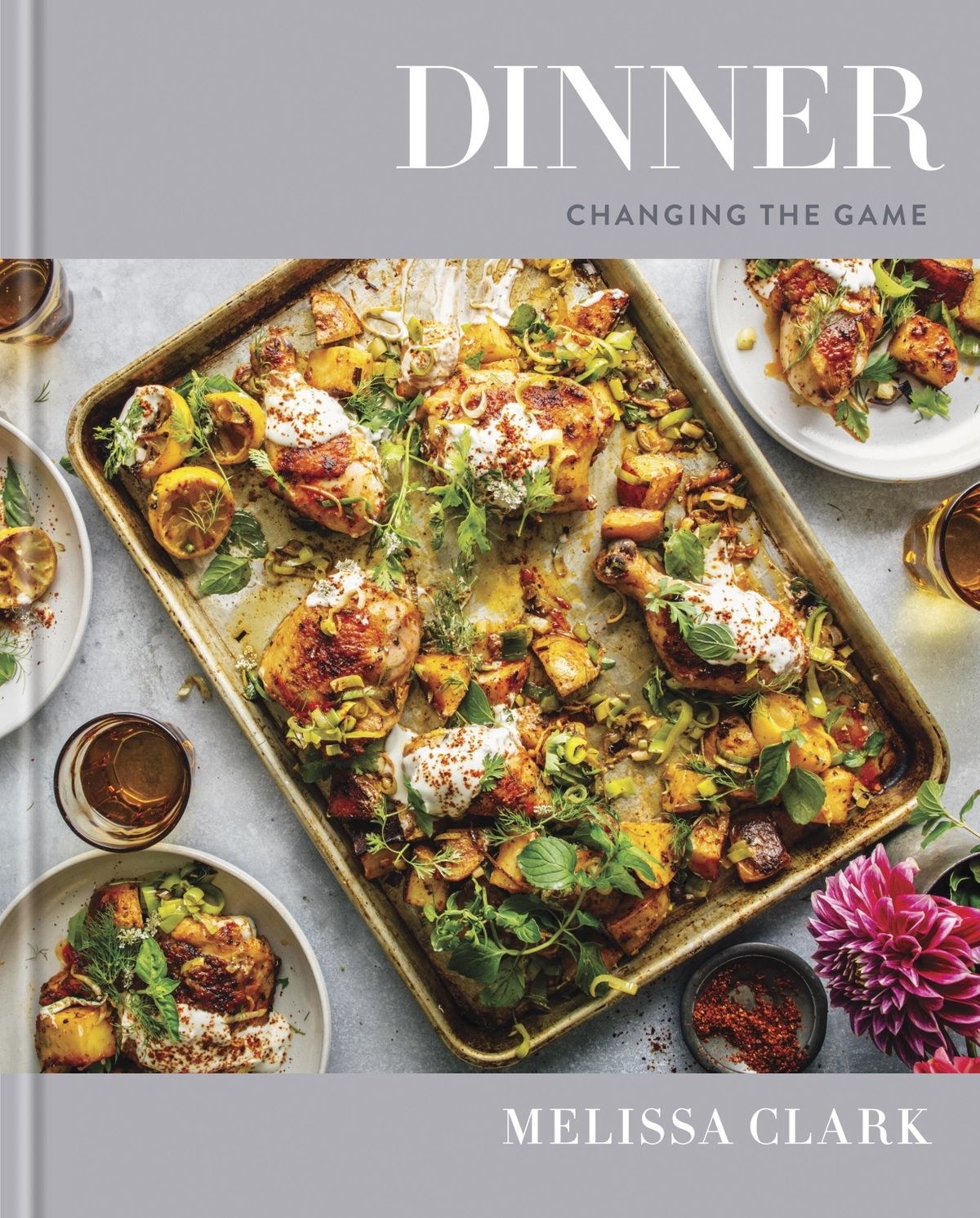 The cover of Melissa Clark&#x27;s cookbook, &quot;Dinner,&quot; with a photo of a sheet pan chicken recipe.