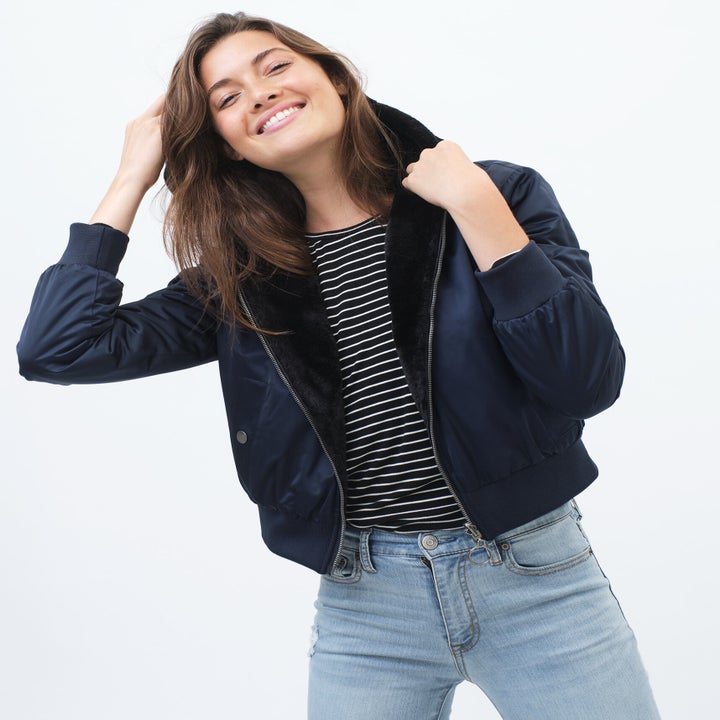 Model in the faux fur-lined hooded jacket