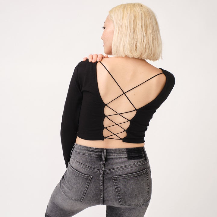 Model in the backless long-sleeve top