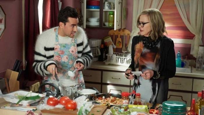 David and Moira rose cooking in the kitchen, looking confused.