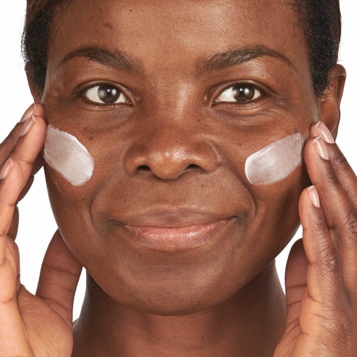 Model applying the cream