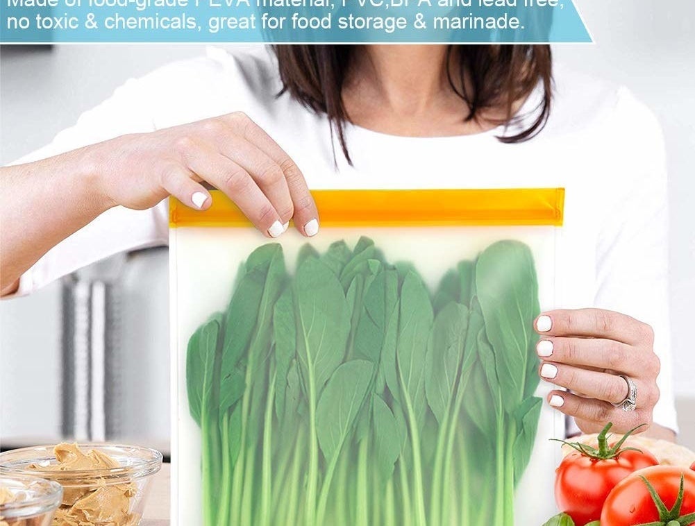 Greens inside a plastic bag being held by a person