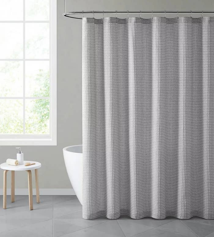 A gray, waffle-weave shower curtain