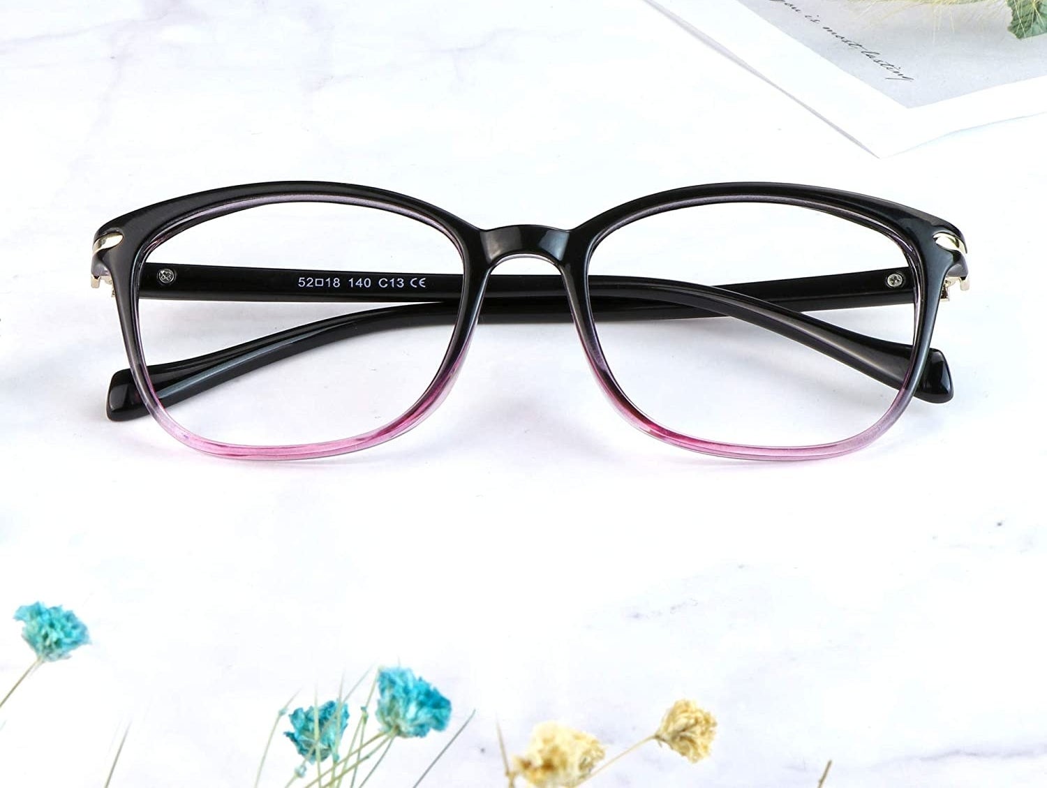 A pair of glasses on a plain background