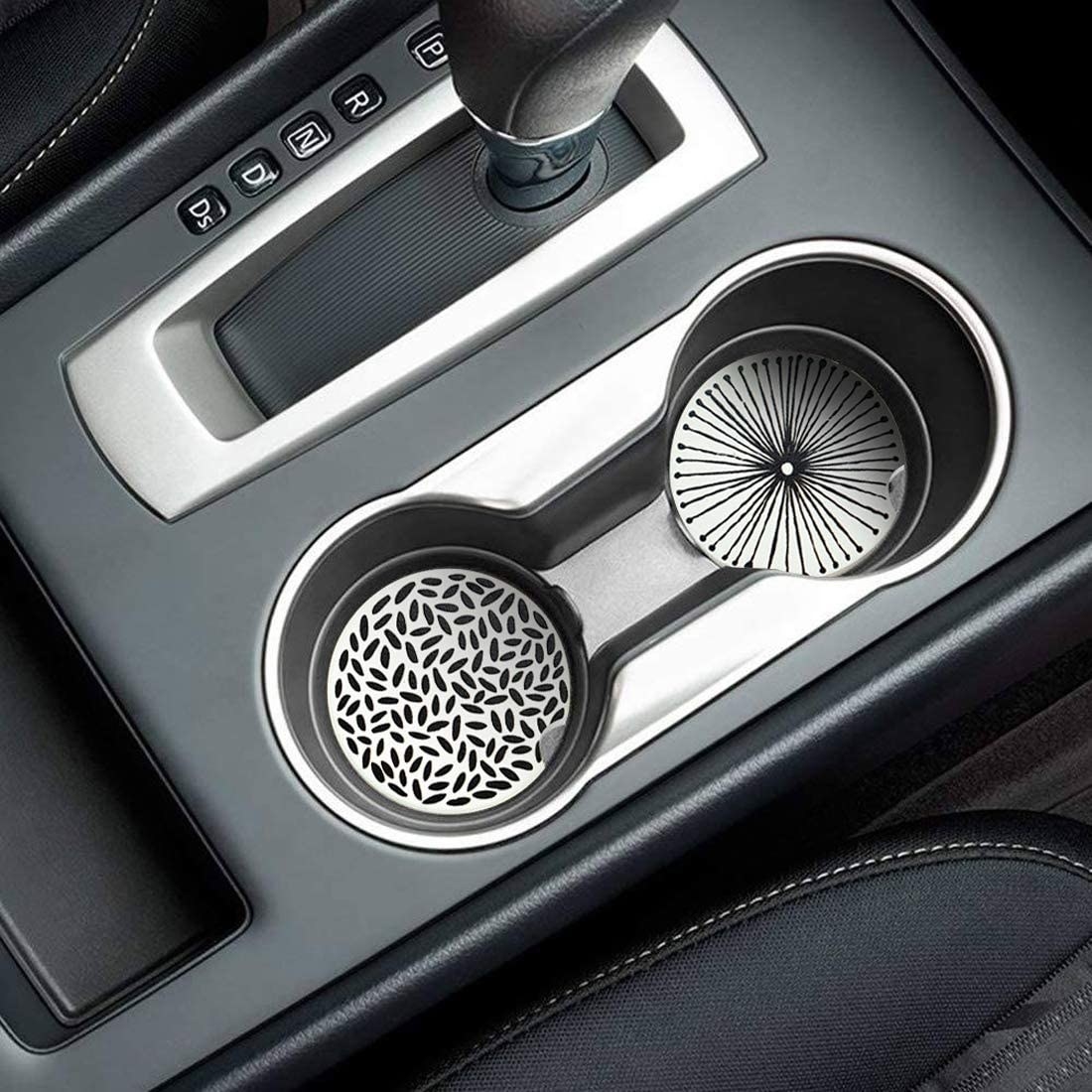 The car coasters protecting the bottom of the cup holders in a car