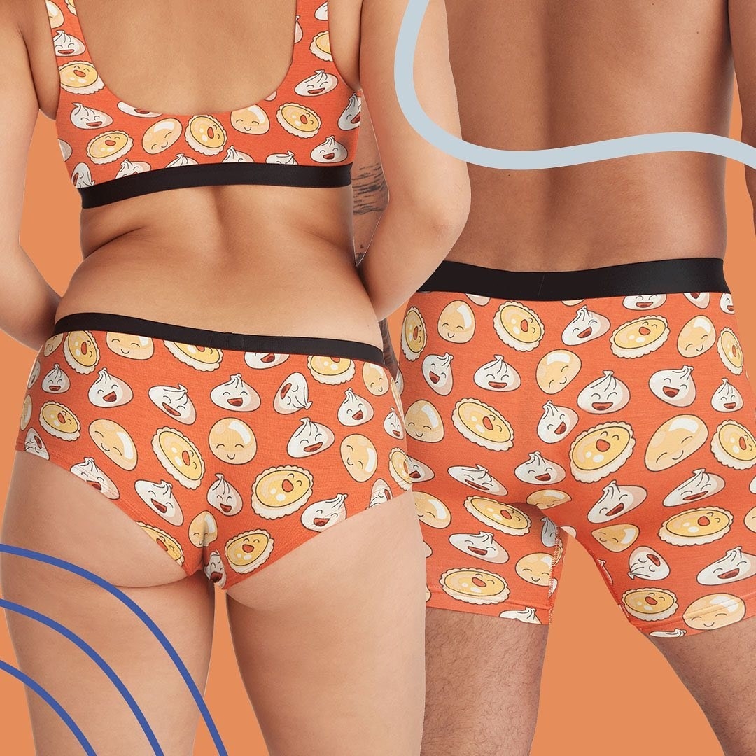 Two models, one wearing a dumpling-print bra and panty set and another wearing dumpling-print boxers