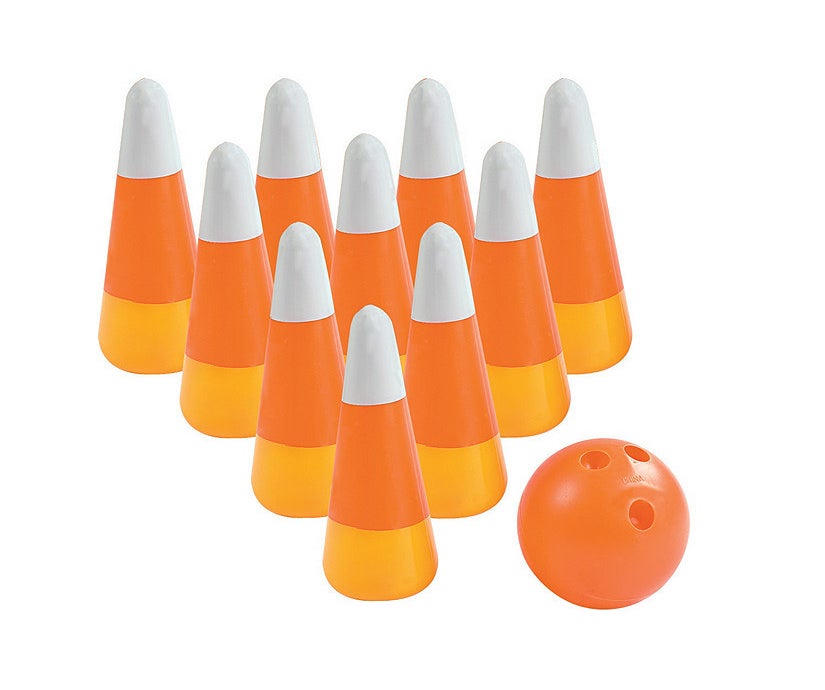 bowling pins that look like candy corn and an orange bowling ball