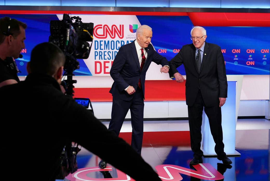 Sanders and Biden bump elbows in greeting