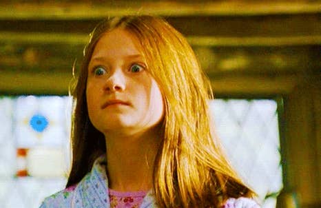 Ginny Weasley staring at Harry Potter in complete shock