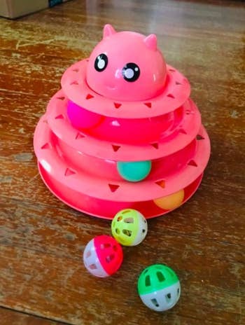pink cat toy tower with balls