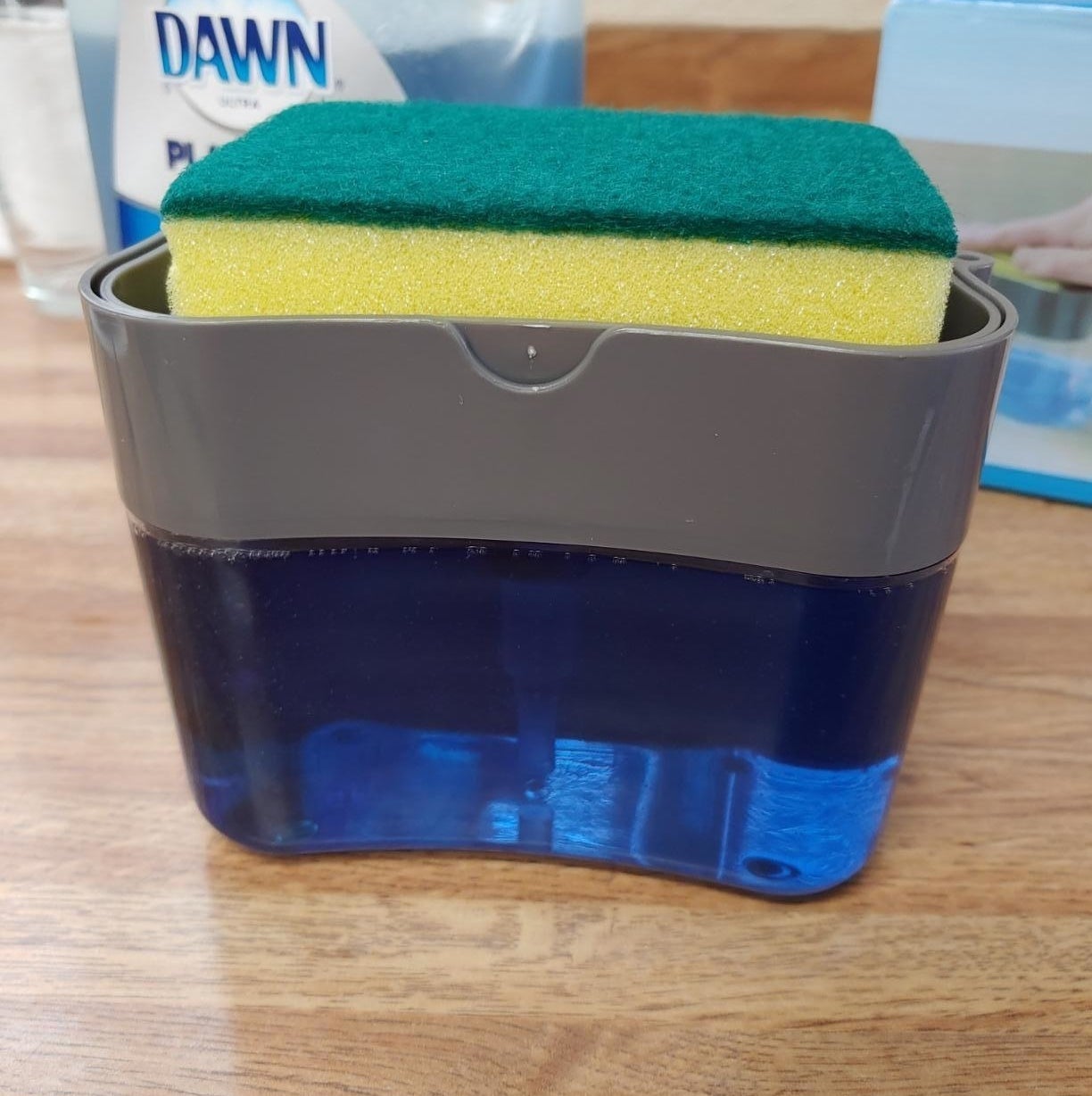 the top of the dispenser also acts as a caddy for the dish sponge 