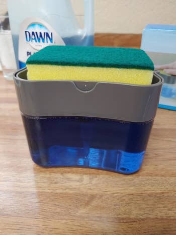 the top of the dispenser also acts as a caddy for the dish sponge 