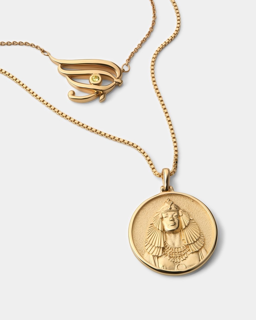 gold necklace with Cleopatra-inspired engraving