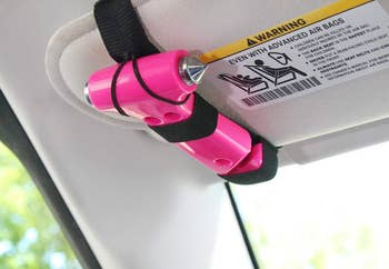 The Safety Hammer Tool strapped on to a car visor. 