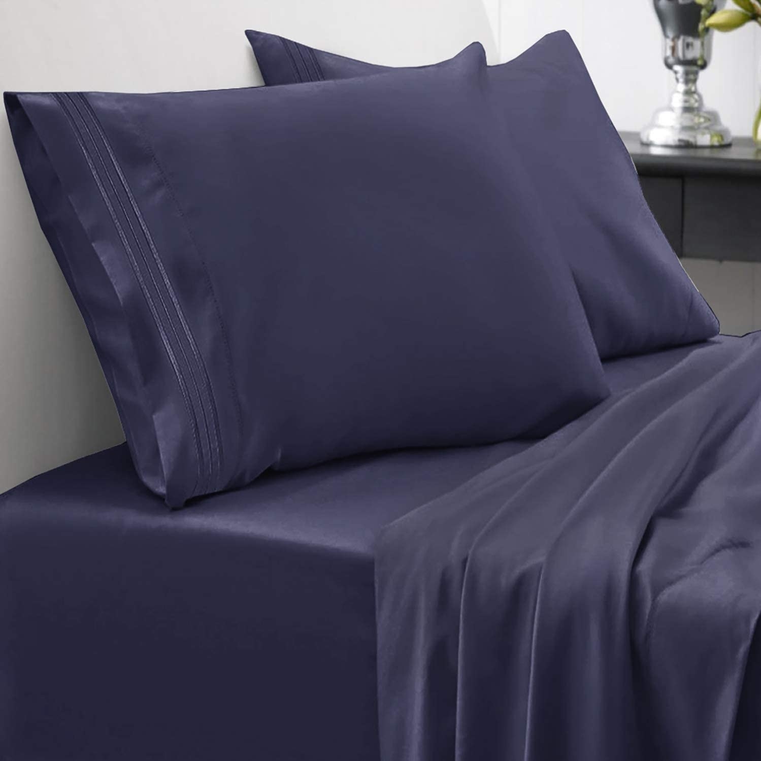 A set of silky microfibre sheets on a bed