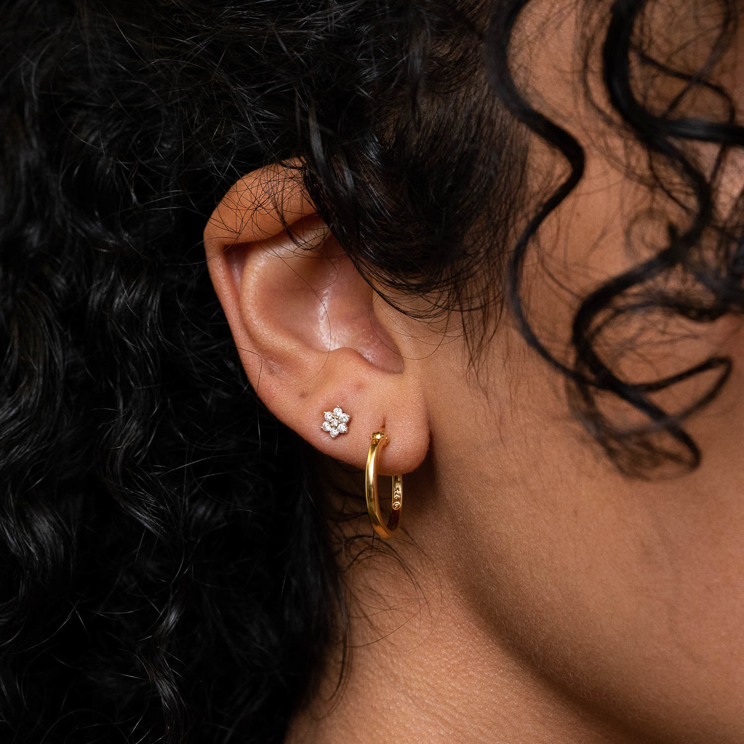 model wearing gold hoop earrings 
