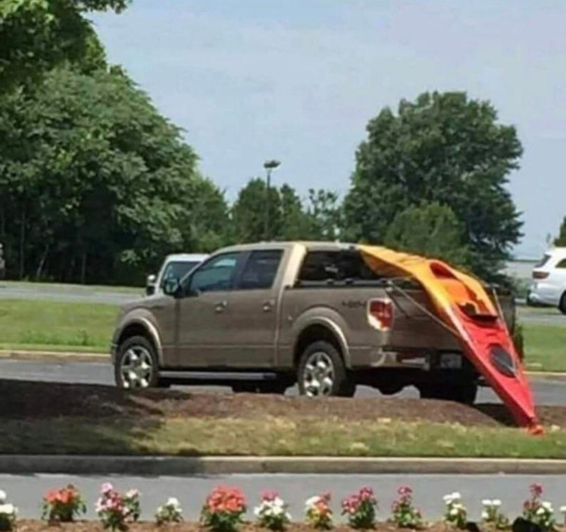 melted kayak on the back of a truck