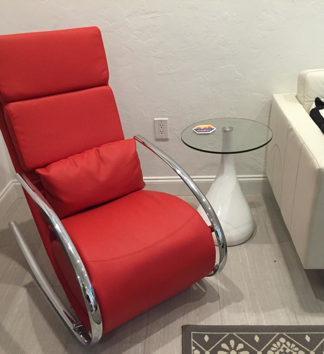 Reviewer pic of the side table with a white teardrop-style base and clear glass top