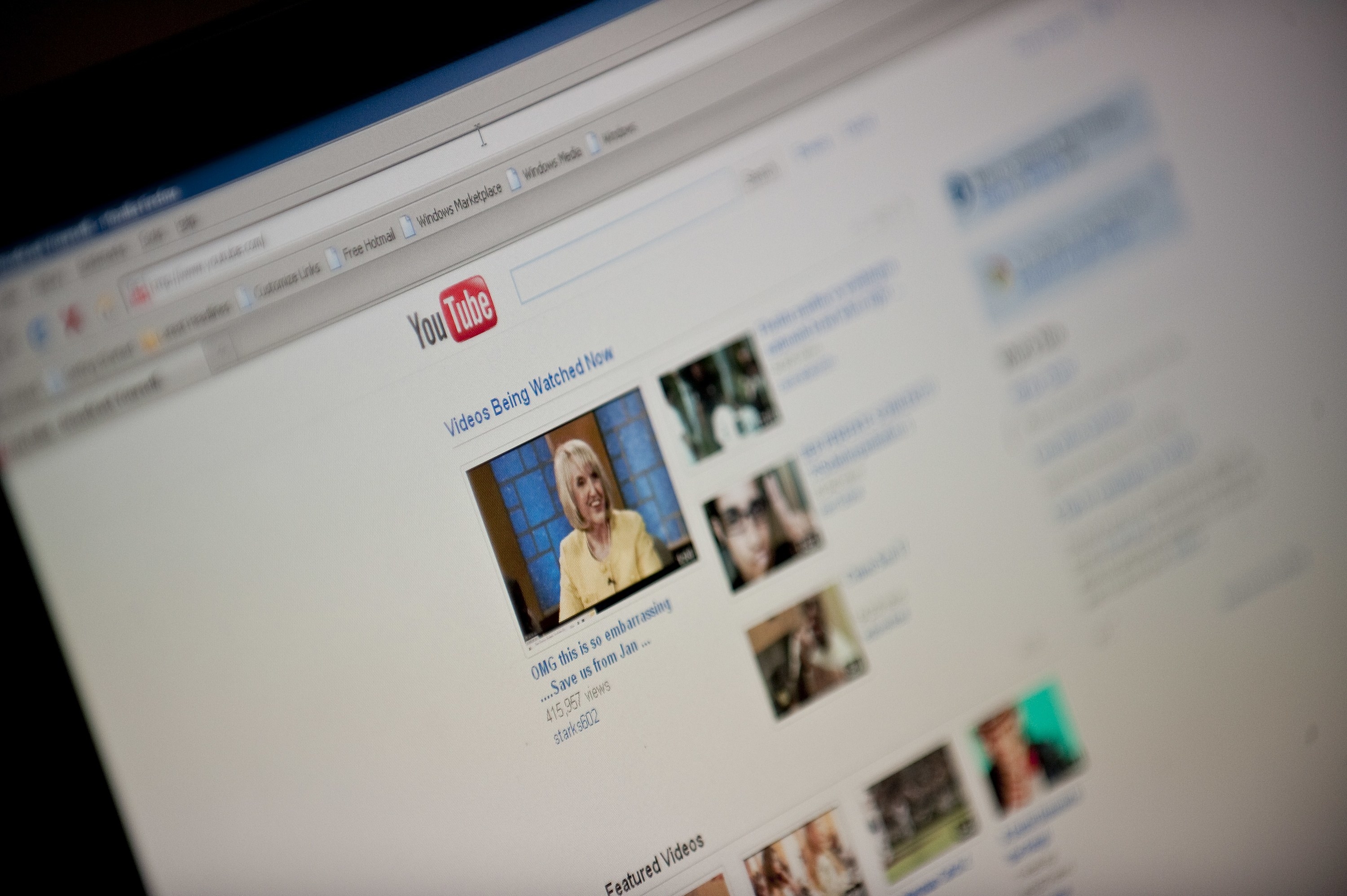 A photo of a computer screen open to the YouTube homepage circa 2010
