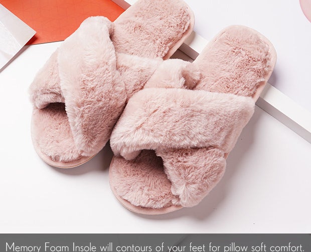A pair of fuzzy slippers on a magazine