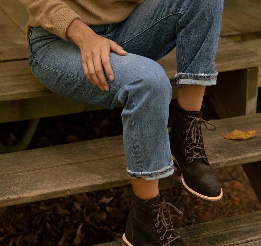 model wearing the brown lace-up ankle boots