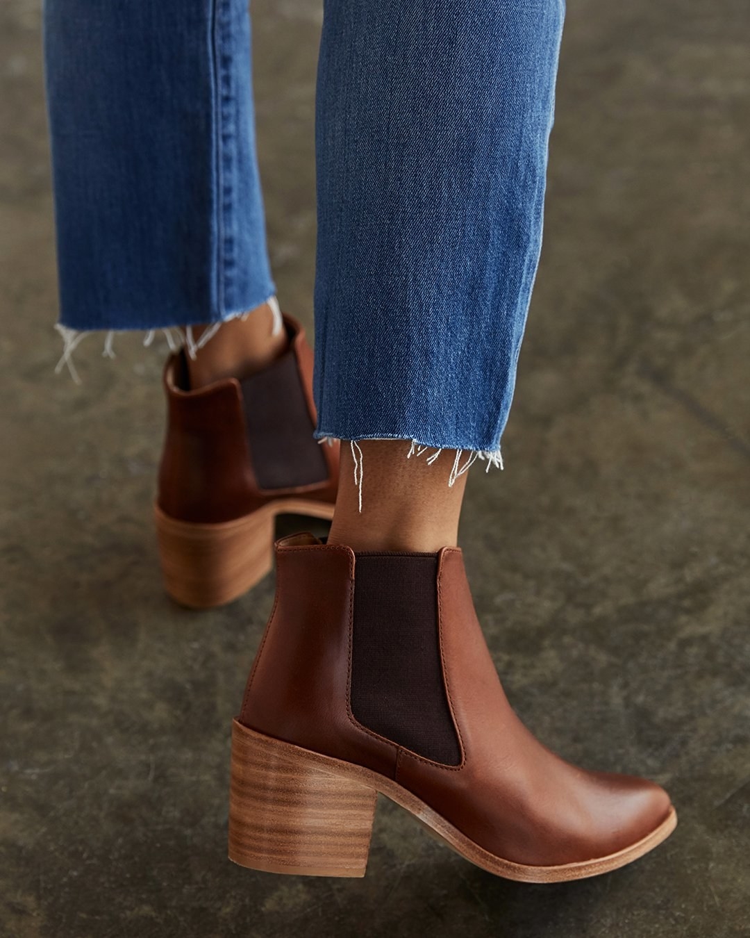 model wearing the brown heeled chelsea boots