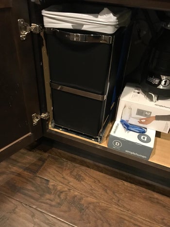 The same customer's pull-out bins pushed under the sink