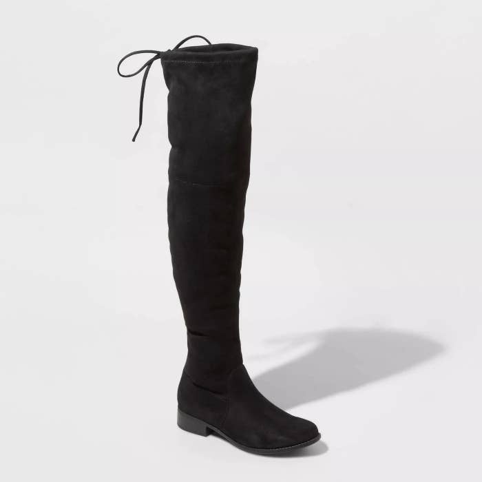 a black microsuede over the knee boot with a tie string at the top