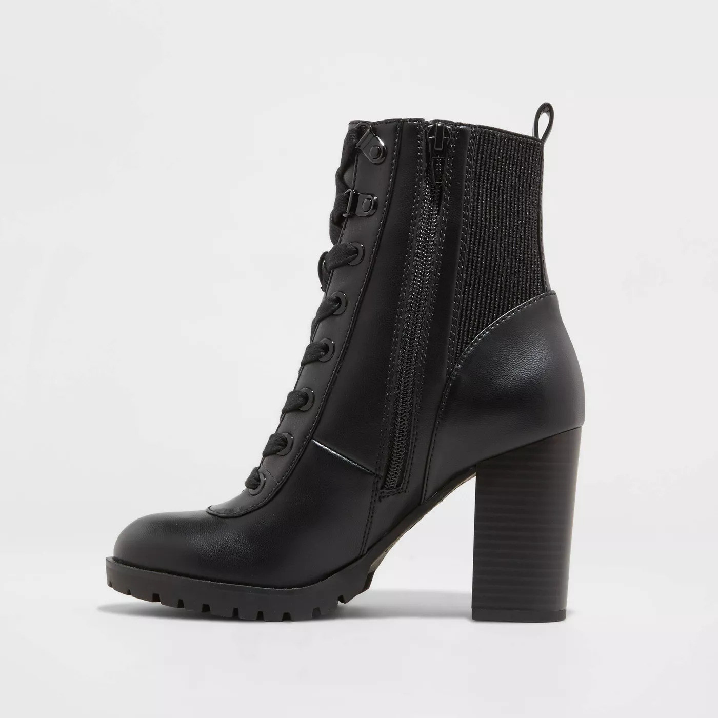 A black bootie with laces in the front, a zipper on the side, and an elastic backing for to provide ease while putting them on.