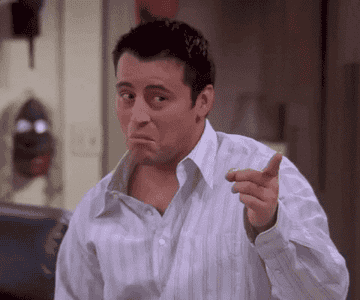 GIF of Joey from Friends tapping his index finger on his temple, indicating something is smart