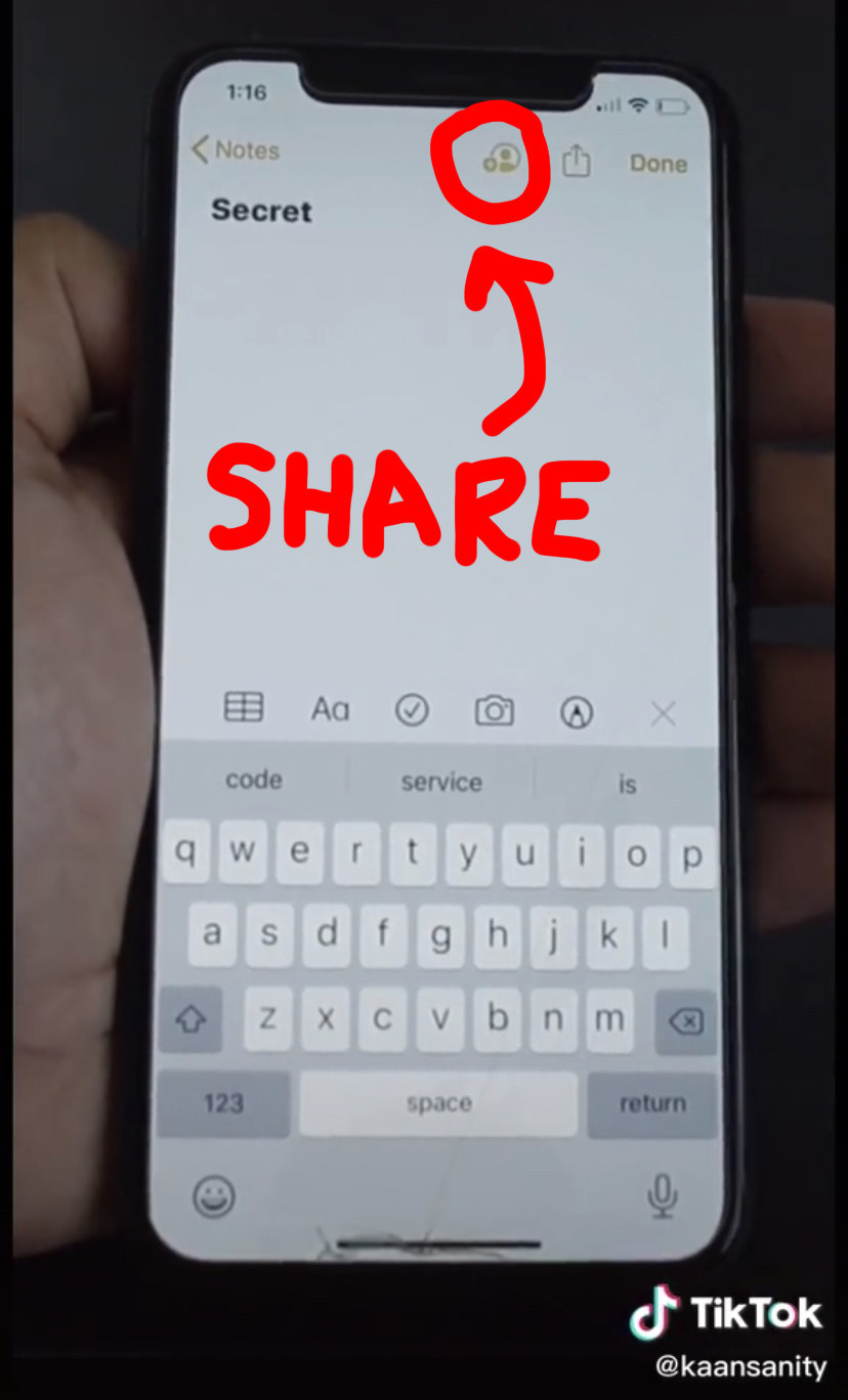 An iPhone with the Notes app open, the &quot;share note&quot; button circled