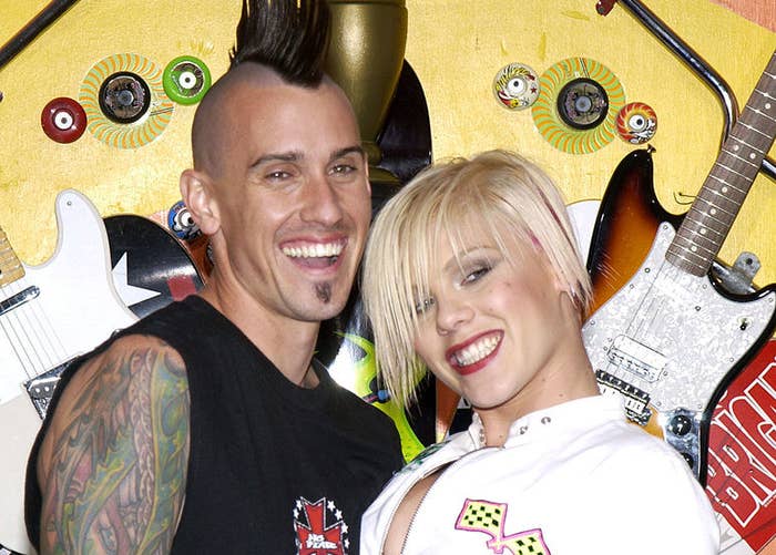 Carey Hart and Pink posing together at a Hollywood event